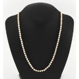 A cultured pearl single strand necklace, the uniform beads approximately 5mm diameter, with 9ct gold
