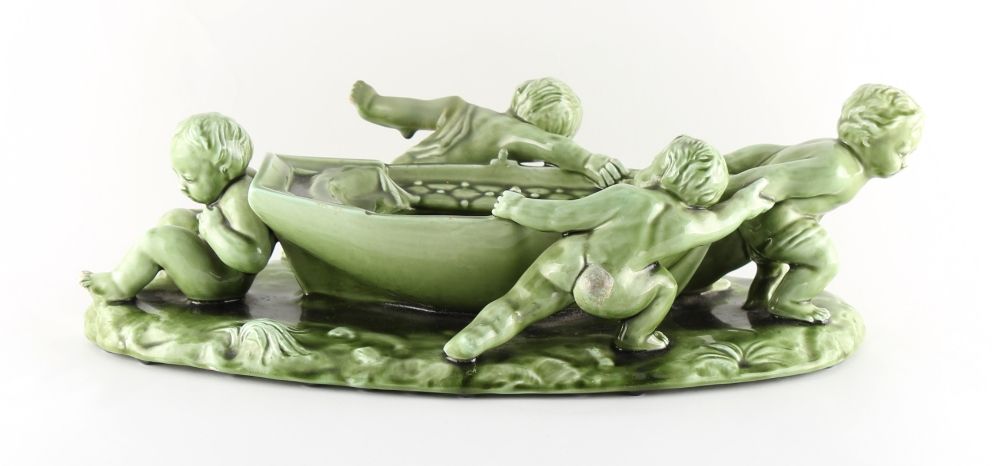 A Clement Massier green glazed centrepiece modelled as four putti hauling a rowing boat, - Image 2 of 2