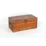 A 19th century teak trunk with bale handles, some brass mounts missing, 28.75ins. (73cms.) wide.