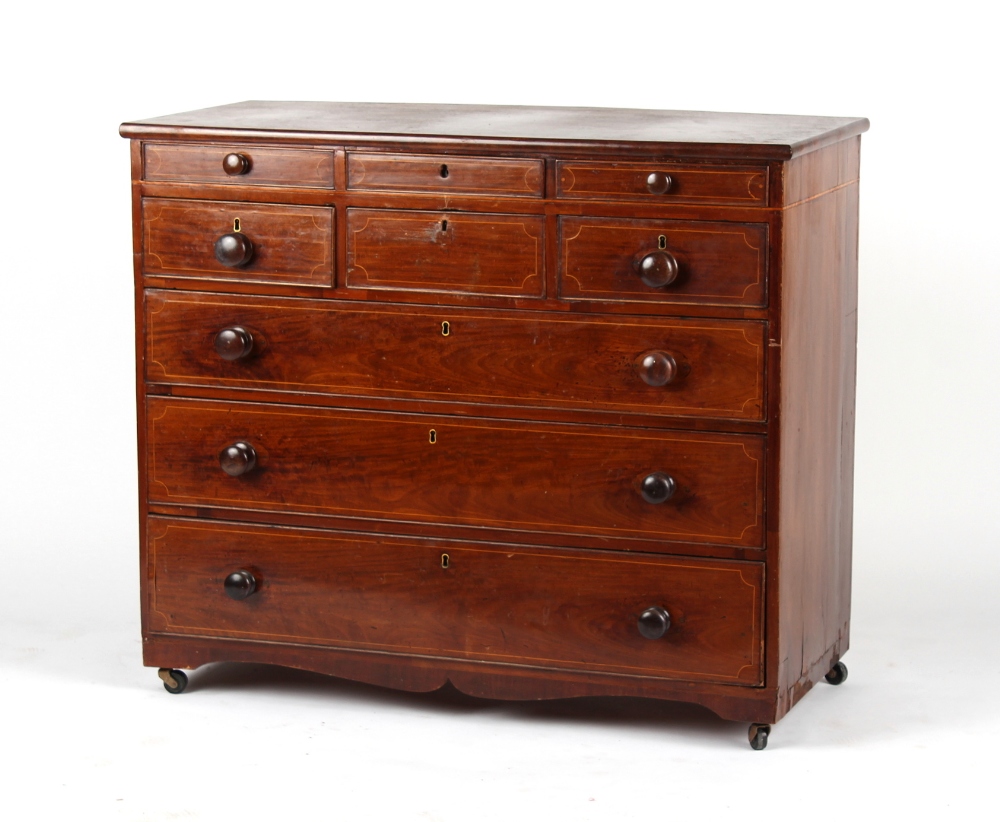 An early 19th century mahogany & boxwood strung scotch chest, on later castors, 46ins. (117cms.)