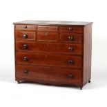 An early 19th century mahogany & boxwood strung scotch chest, on later castors, 46ins. (117cms.)