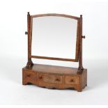 A mahogany & banded swing frame toilet mirror with bow-fronted three-drawer base.