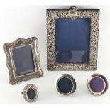Five silver photograph frames, the largest 11.8ins. (30cms.) high (5).