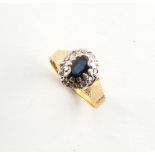 An 18ct yellow gold sapphire & diamond cluster ring, approximately 4.4 grams, size M.