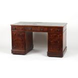 A Victorian figured walnut twin pedestal desk with nine mahogany lined drawers, 54.25ins. (
