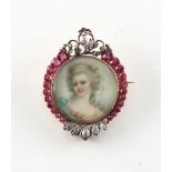 A good 19th century ruby & diamond brooch centred by a portrait miniature of a young lady in blue