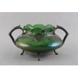 An early 20th century Art Nouveau pewter mounted green iridescent glass, the pewter foot rim