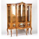 A French Louis XV style gilt metal mounted kingwood vitrine, 49.5ins. (126cms.) wide (overall).