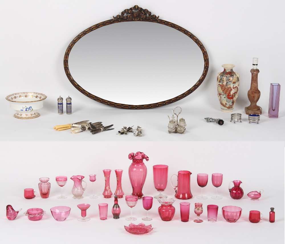 A mixed lot including cranberry glass items, silver plated items, ceramics, a lamp, and an oval