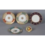 Three Minton bone china richly gilded plates, each 10.65ins. (27cms.) diameter; together with a