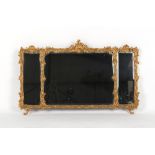 A gilt painted triple plate overmantel mirror, with bevelled glass, 44.25ins. 112.5cms.) wide (