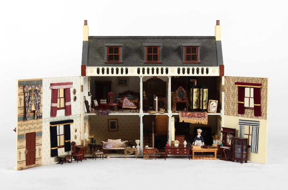 A large doll's house with furniture & furnishings, 31.5ins. (80cms.) long. - Image 2 of 2