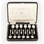 A cased set of twelve silver coffee spoons, Sheffield 1935/6, approximately 138 grams.