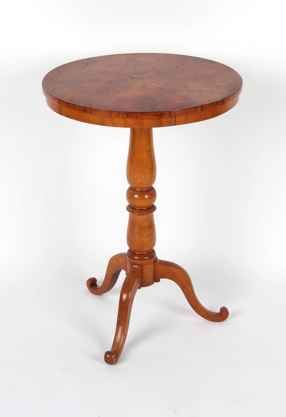 A fruitwood circular topped tripod occasional table, 20ins. (51cms.) diameter.