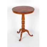 A fruitwood circular topped tripod occasional table, 20ins. (51cms.) diameter.