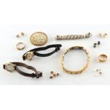 A bag containing assorted jewellery including an Edwardian 18ct gold buckle ring, approximately 3.