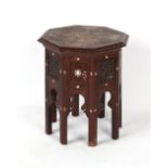 An Indian carved hardwood & mother-of-pearl inlaid octagonal occasional table, a few losses to