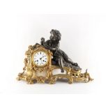 A late 19th century French gilt metal alabaster & spelter figural mantel clock, the 8-day movement