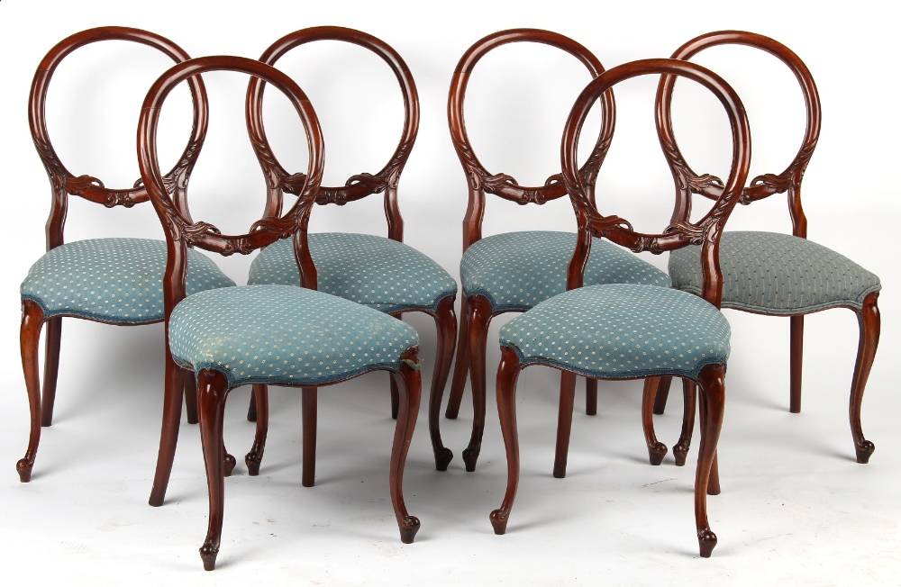 A set of six Victorian style mahogany balloon back dining chairs, with pale blue upholstery &