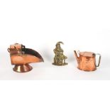 A Victorian copper helmet coal scuttle; together with a similar watering can; and a cast brass