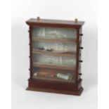 A late 19th / early 20th century mahogany tobacconists shop display cabinet or cigarette