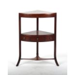 An early 19th century George IV mahogany & ebony strung corner washstand.