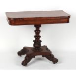 A William IV mahogany fold-over tea table, circa 1835, with carved tulip decorated column &