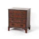 A small 19th century mahogany chest of four long graduated drawers, adapted from a commode, 25.5ins.