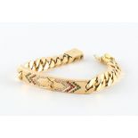 A heavy yellow gold identity type bracelet, marked 750, the panel set with diamonds, rubies &