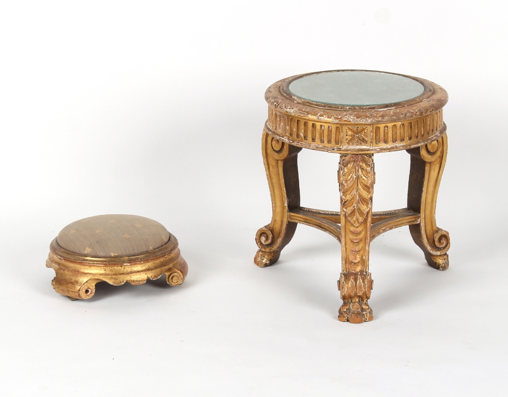 A 19th century carved giltwood stand, 16.2ins. (41cms.) high; together with a similar footstool (2).
