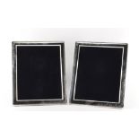 A pair of modern silver rectangular easel photograph frames, each 11.5 by 9.5ins. (29.2 by 24.1cms.)