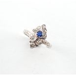 A Belle Epoque style white gold sapphire & diamond ring, the round cut sapphire weighing