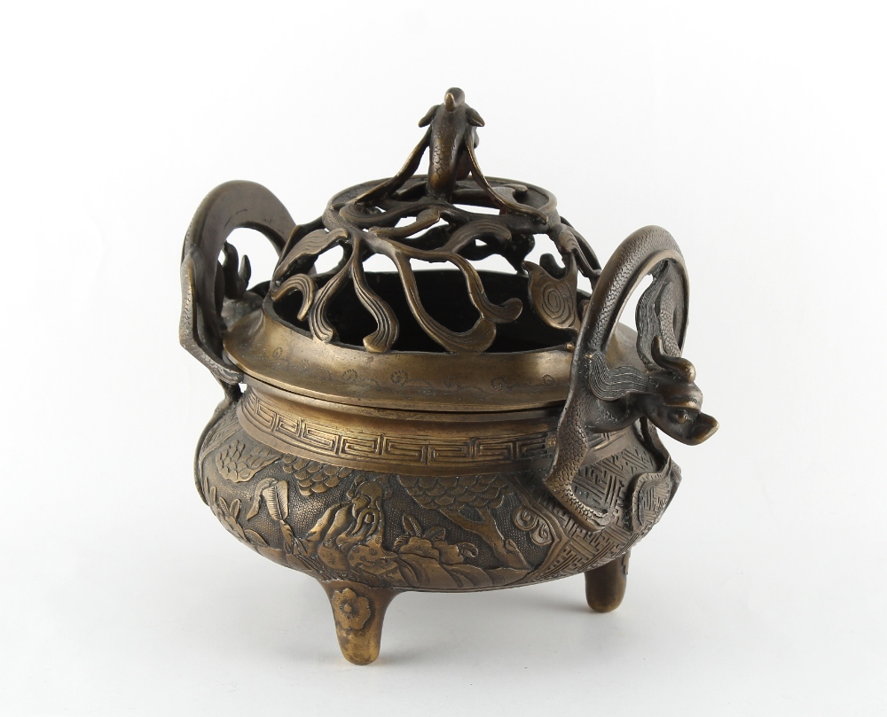 A Chinese ornate bronze censer, the pierced cover with dragon finial, 8.7ins. (22cms.) across ( - Image 2 of 3