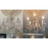 Property of a deceased estate - a large pair of clear glass six light chandeliers or electroliers,