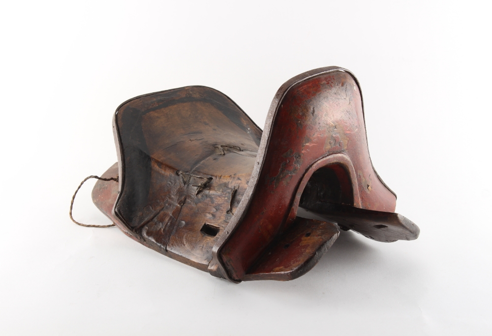 Property of a gentleman - a 19th century Chinese or Tibetan saddle with red painted decoration, 16.