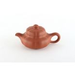 A Chinese Yixing teapot, of melon form, seal marks to base and another to inside of cover, 5.
