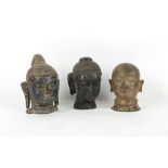 Property of a gentleman - a bronze Buddha head; together with a carved green/black stone Buddha