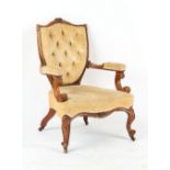 Property of a gentleman - a Victorian carved walnut & button upholstered armchair, with cabriole