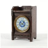 Property of a lady - an Aesthetic Movement oak cased mantel clock with blue & white ceramic dial,