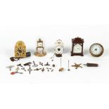 Property of a deceased estate - a group of five small clocks including two Continental alarm wall