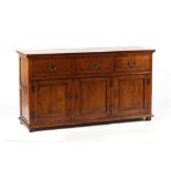 Property of a gentleman - a reproduction oak dresser base with fielded panelled doors & drawers,