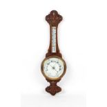 Property of a gentleman - a late Victorian carved oak aneroid barometer & thermometer, 32.25ins. (