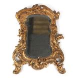 Property of a lady - a 19th century carved giltwood framed wall mirror with shaped & bevelled plate,