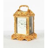 Property of a deceased estate - an ornate gilt brass or ormolu cased carriage clock, the two train
