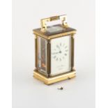Property of a deceased estate - a brass cased carriage clock timepiece, the enamel dial inscribed