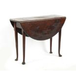 Property of a deceased estate - a mid 18th century George II Cuban mahogany oval drop-leaf table