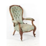 Property of a gentleman - a Victorian carved walnut & button upholstered armchair with cabriole