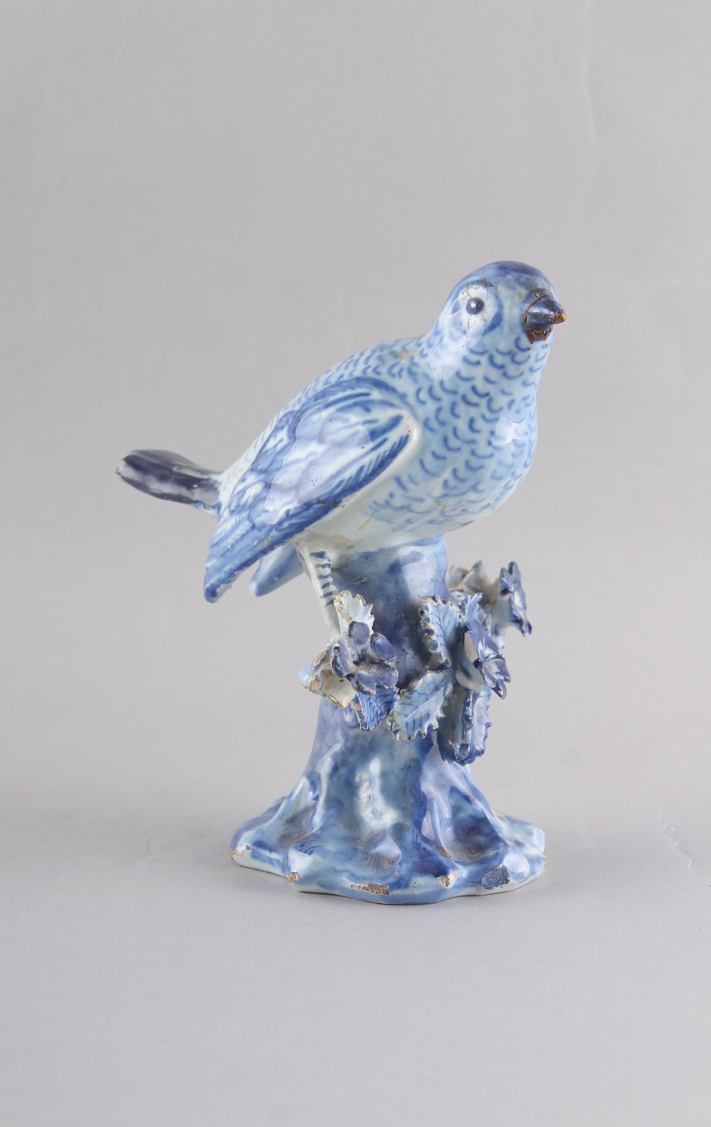 Property of a deceased estate - a late 18th century Dutch Delft blue & white model of a bird perched
