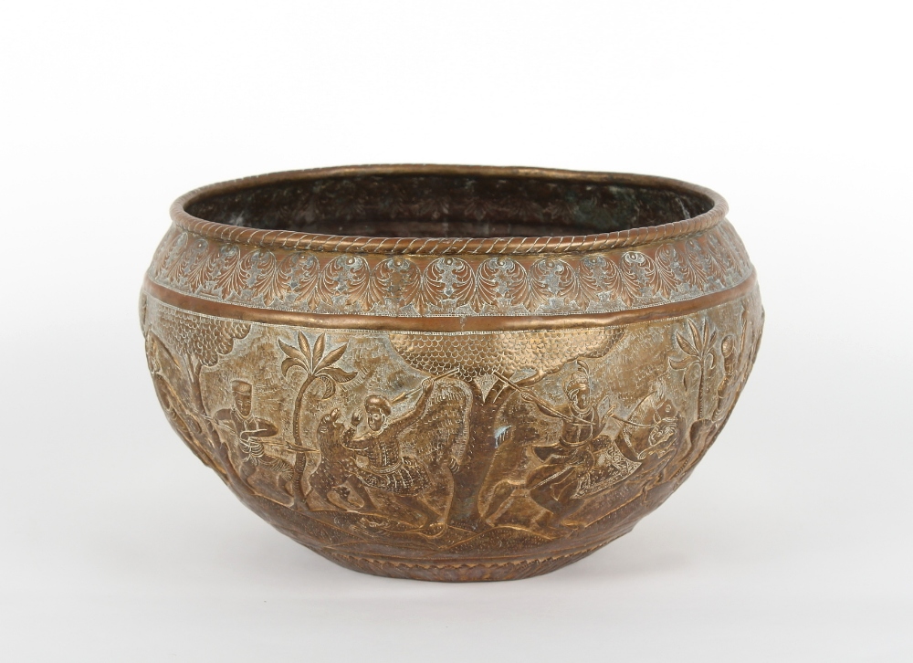 Property of a lady - an Indian brass large pot or jardiniere with repousse decoration depicting