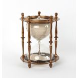 Property of a deceased estate - a Victorian brass framed hour glass, with five turned pillars, 8.